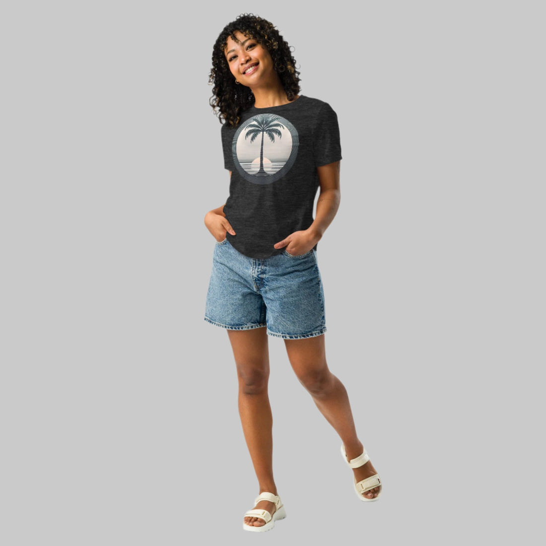 Front of Woman wearing T-shirt in Dark Grey with Palm Tree Design.