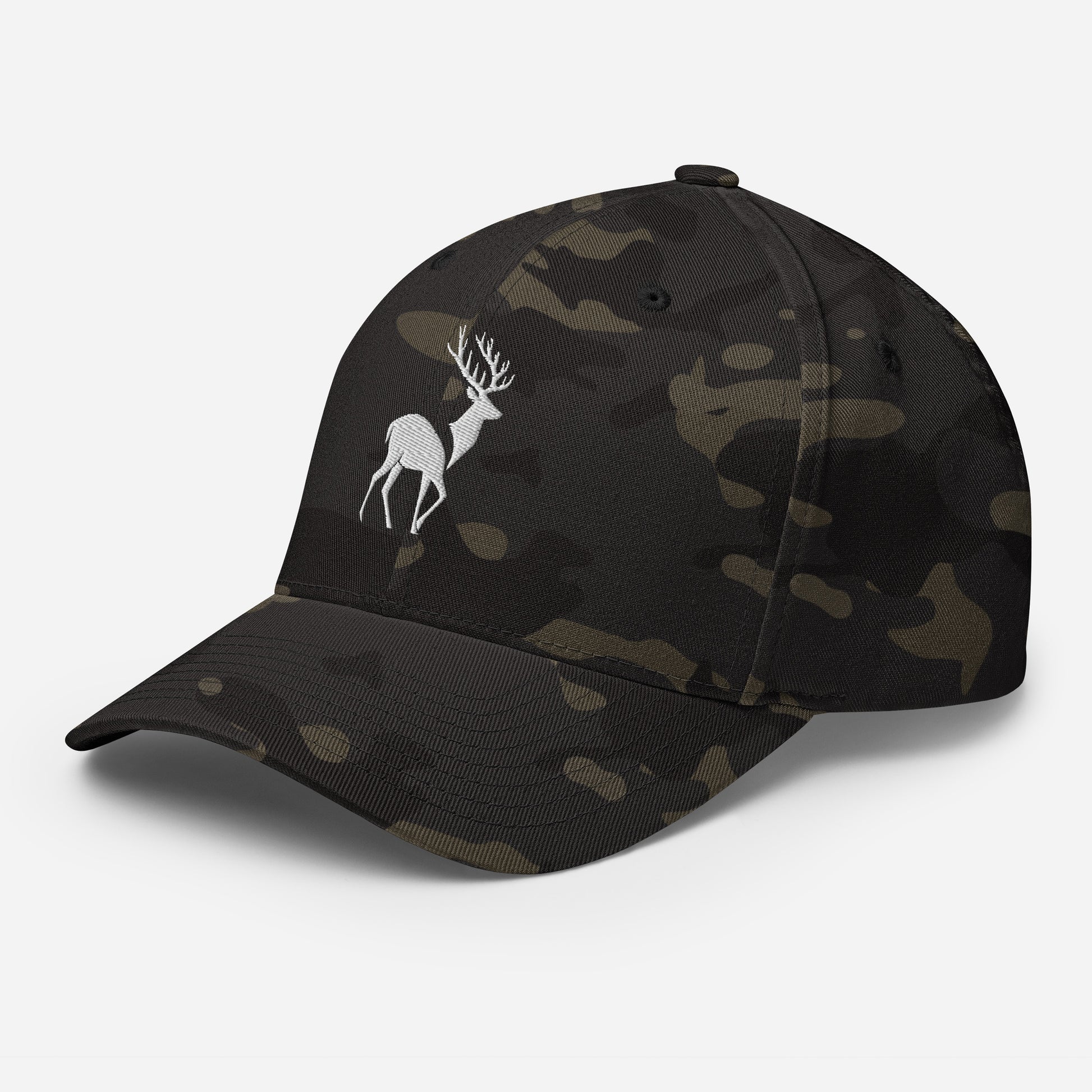 Left Front of Big Buck FlexFit Hat in Multicam Black, with white deer embroidery on front.