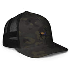Right Front of Big Buck FlexFit Trucker Hat in Multicam Black, with deer embroidery on front.