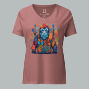 Front of women’s V-neck tee in heather mauve with a multihued camo-style Bigfoot graphic among forest elements.