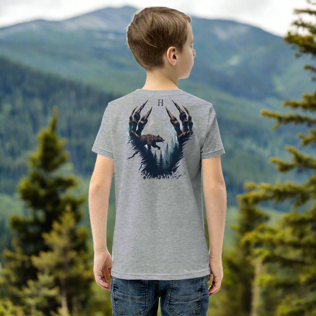 Back of Boy wearing Clawed Through Wild T-shirt in Grey with Bear Claw Forest Design.