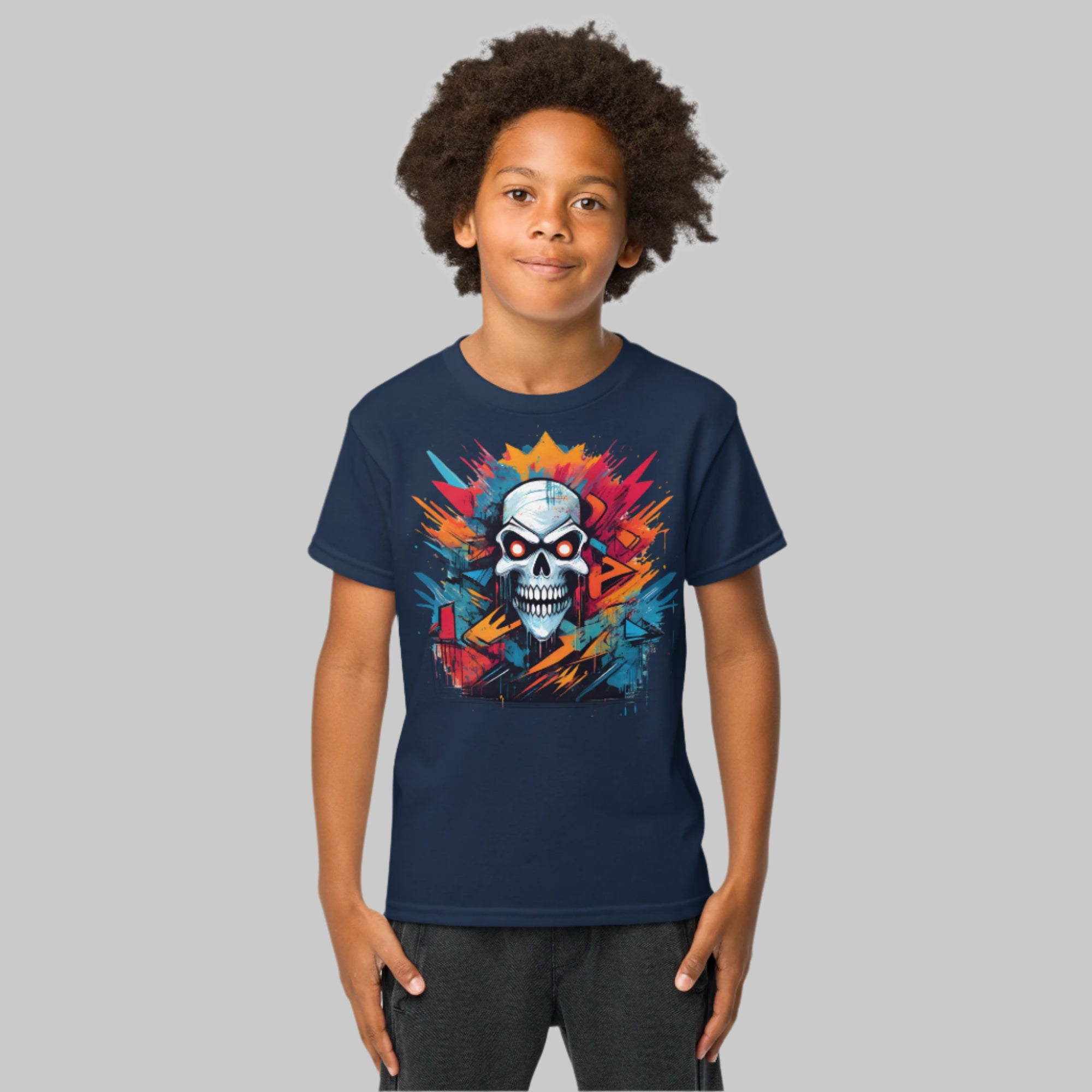 Front of  Boy wearing T-shirt in Navy with Grinning Skull in multiple colors design.