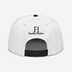 Back of Buck Snapback Hat in white, with black snap enclosure and embroidered FH logo.
