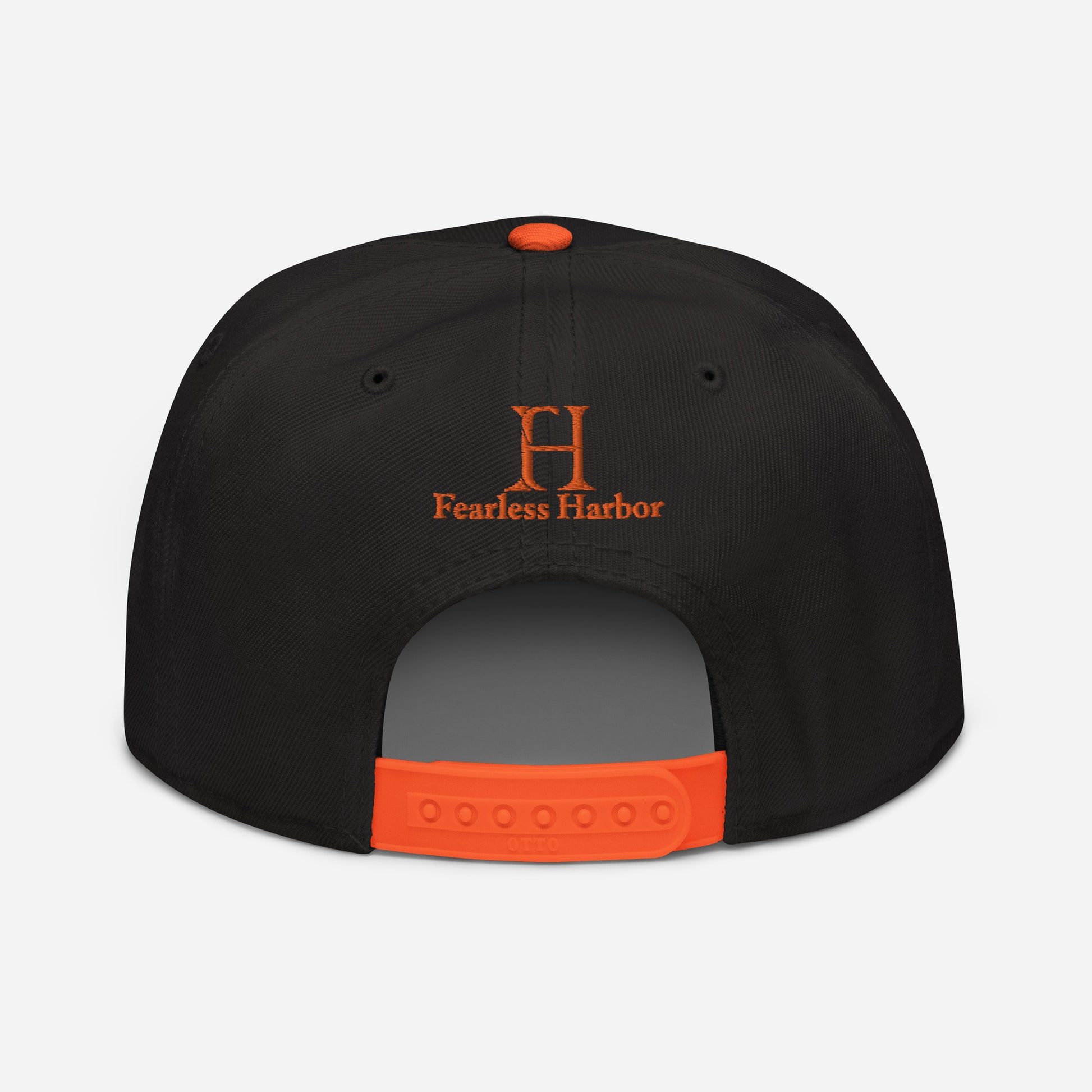 Back of Buck Snapback Hat in Black, with orange snap enclosure and embroidered FH logo.