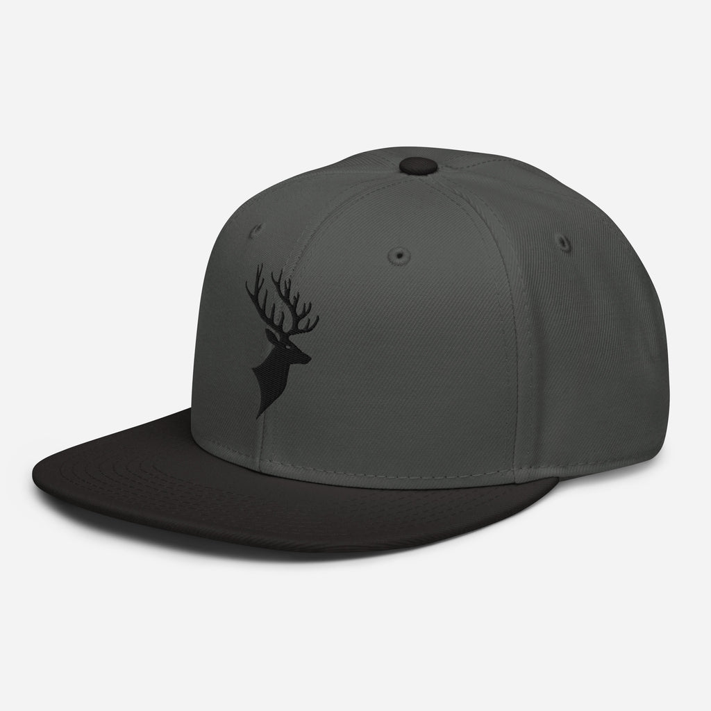 Left Front of Buck Snapback Hat in Charcoal Grey with black visor, and black Deer head embroidery on front.