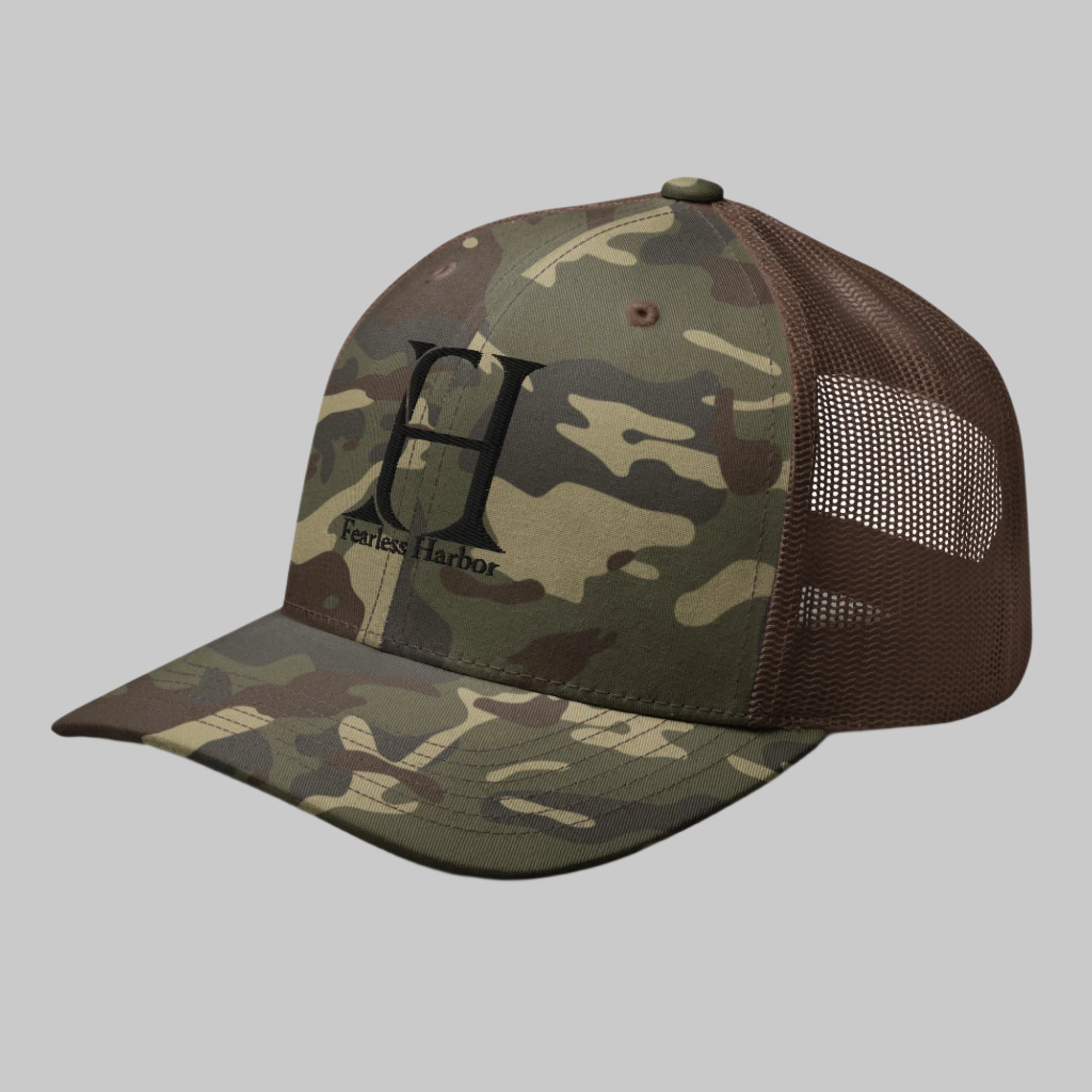 Left Front of Fearless Harbor Camouflage Trucker Hat in Camo Brown with FH logo and the words Fearless Harbor.