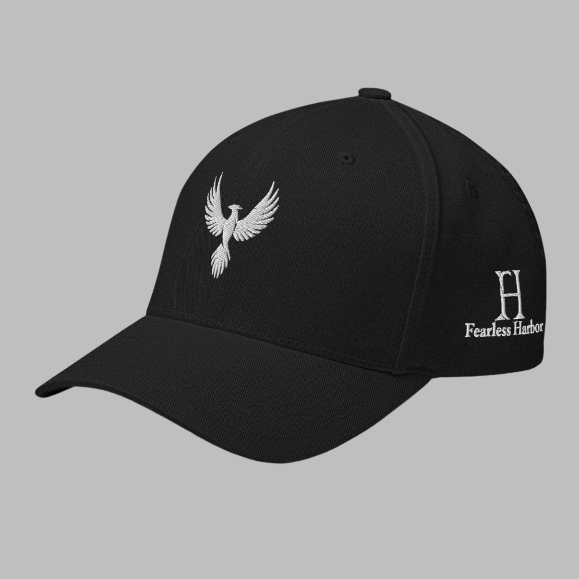 Left Front of Fearless Harbor FlexFit Hat in Black with white phoenix logo embroidery on front and FH logo on left side.