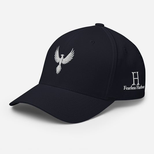 Left Front of Fearless Harbor FlexFit Hat in Navy with white phoenix logo embroidery on front and FH logo on left side.