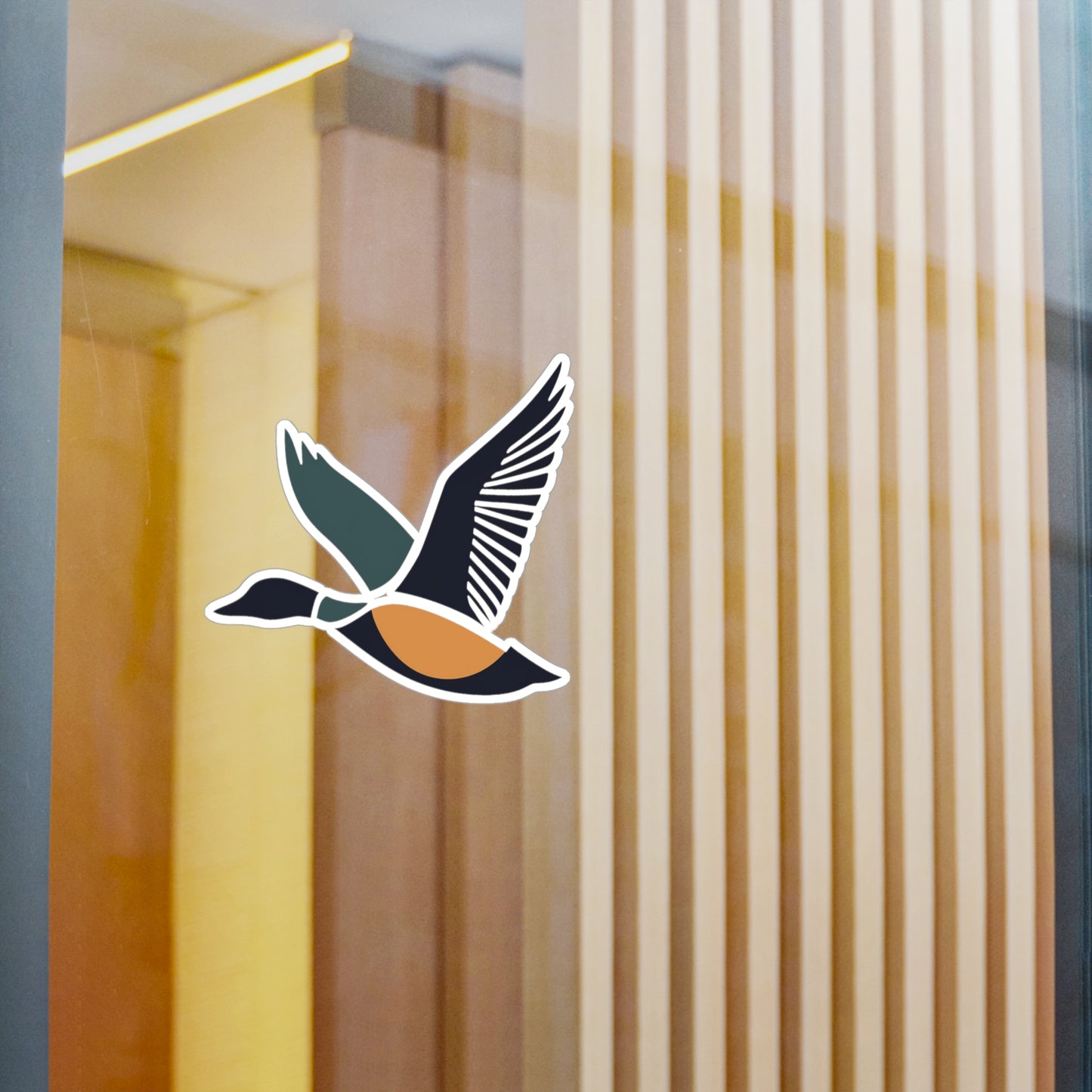 Flying Duck Vinyl Sticker displayed on a window.