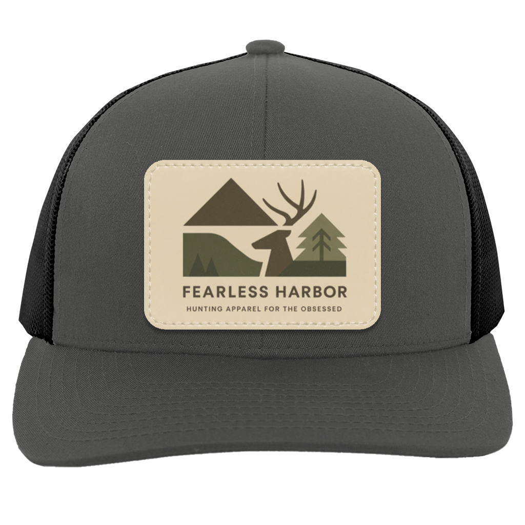 Graphite Black trucker hat showing Fearless Harbor buck patch on front panel.