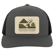 Graphite Black trucker hat showing Fearless Harbor buck patch on front panel.