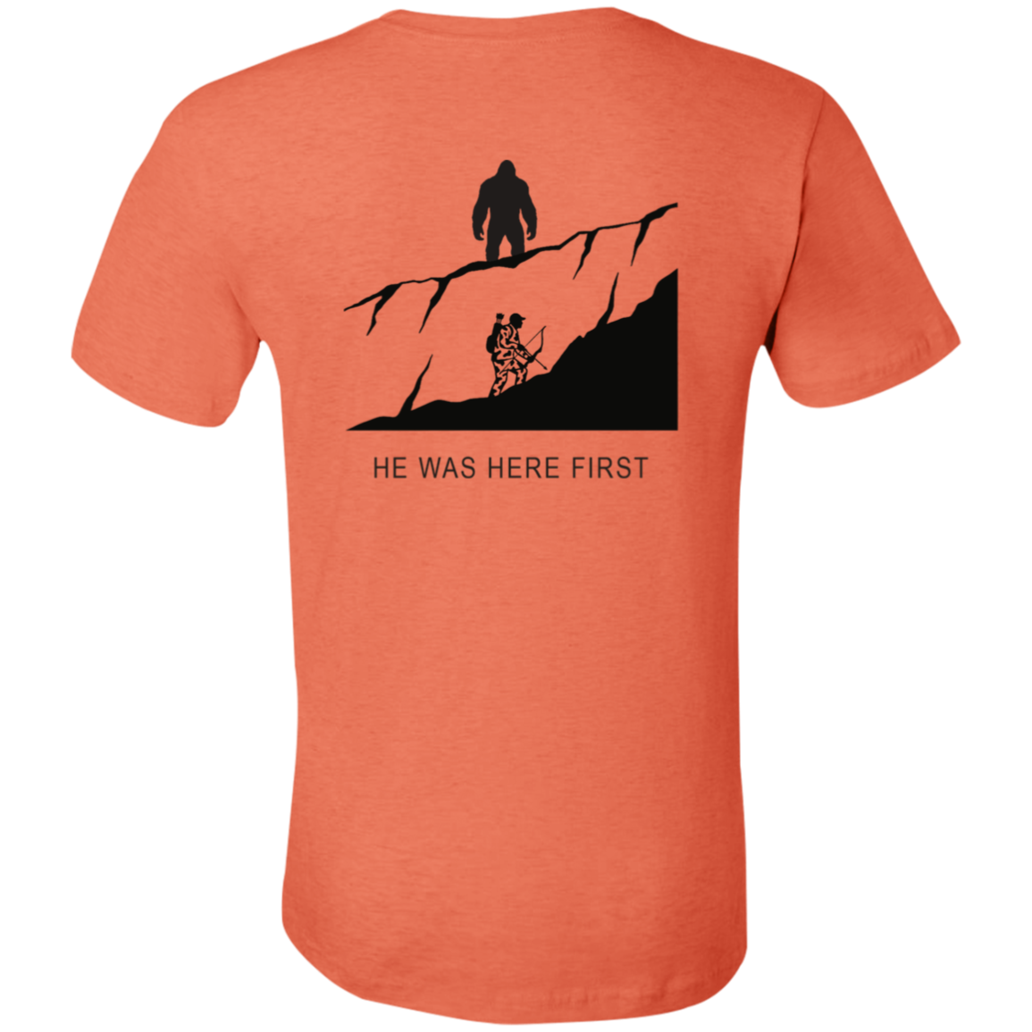 Back view of the Men’s He Was Here First Bigfoot Hunting Tee in Heather Orange showing a large graphic of Bigfoot standing on a ridge above a climbing bowhunter with He Was Here First text.