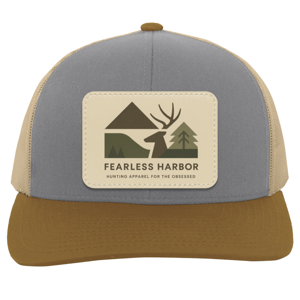 Heather Beige Amber trucker hat with Fearless Harbor buck patch displayed on front.