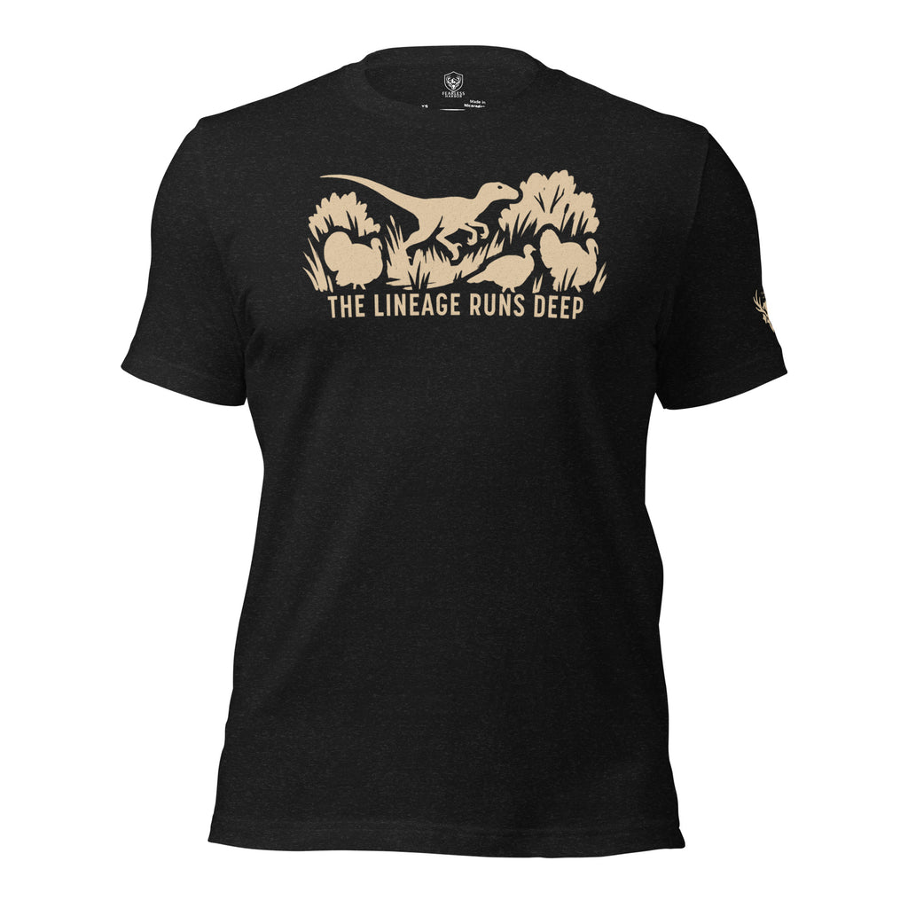 Front view of the Heather Black Men’s Raptor Deep Roots Turkey Core Tee featuring a prehistoric raptor walking alongside wild turkeys, representing the evolutionary lineage of modern birds.