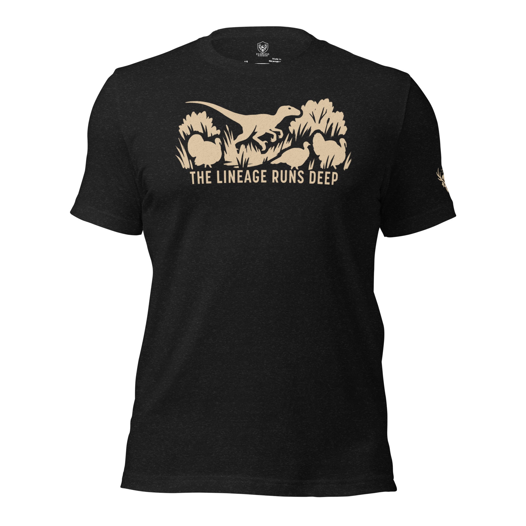 Front view of the Heather Black Men’s Raptor Deep Roots Turkey Core Tee featuring a prehistoric raptor walking alongside wild turkeys, representing the evolutionary lineage of modern birds.