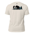 Men’s heather dust prehistoric hunting tee with ancient mammoth hunter scene and Bigfoot silhouette