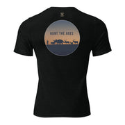 Back view of Mens Hunt the Ages Premium Everyday Tee in solid black showing a prehistoric hunter, Triceratops, and elk silhouettes.