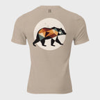 Back of Fearless Harbor Bear Edition T-Shirt in Tan with black, orange, and green bear design and FH logo near collar.