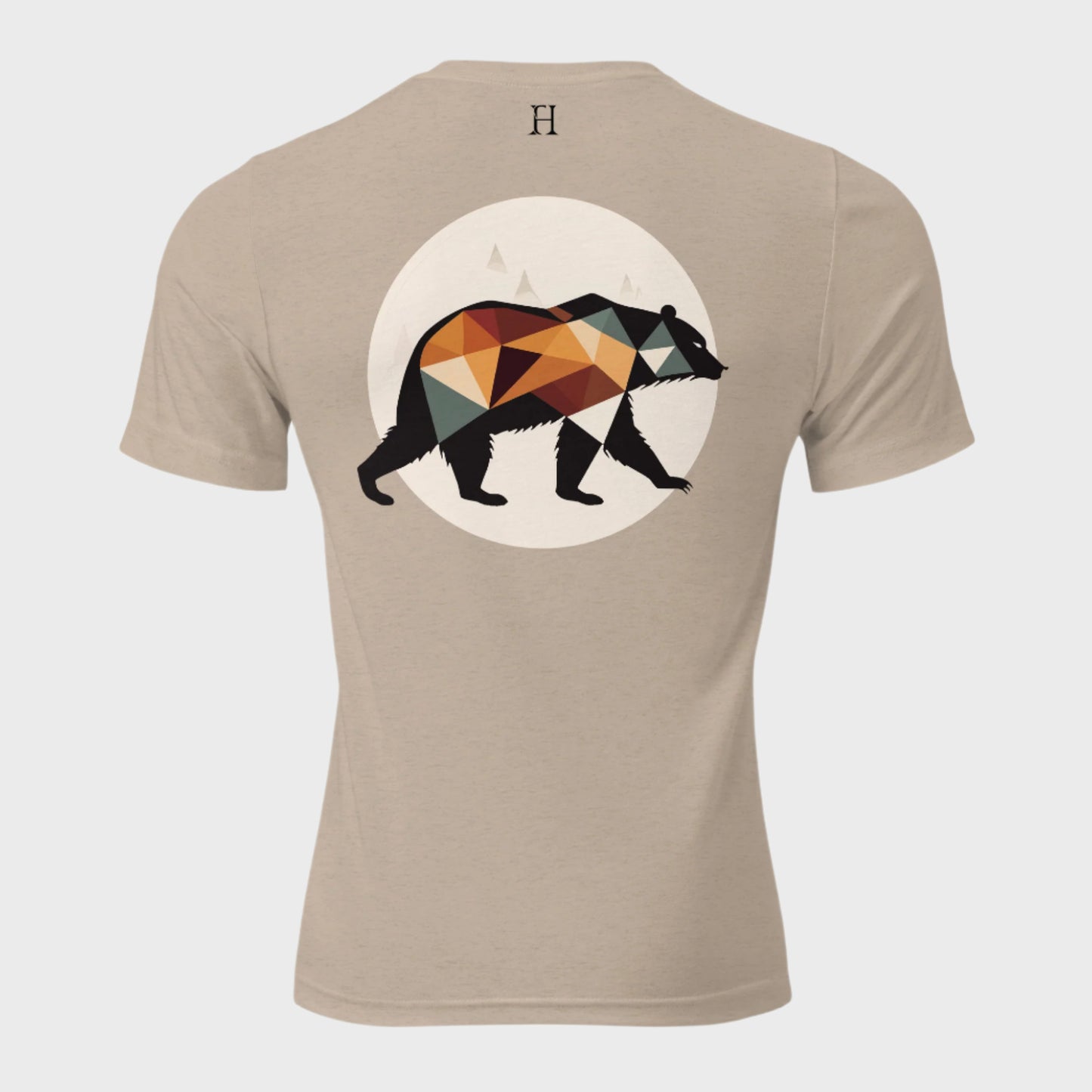 Back of Fearless Harbor Bear Edition T-Shirt in Tan with black, orange, and green bear design and FH logo near collar.