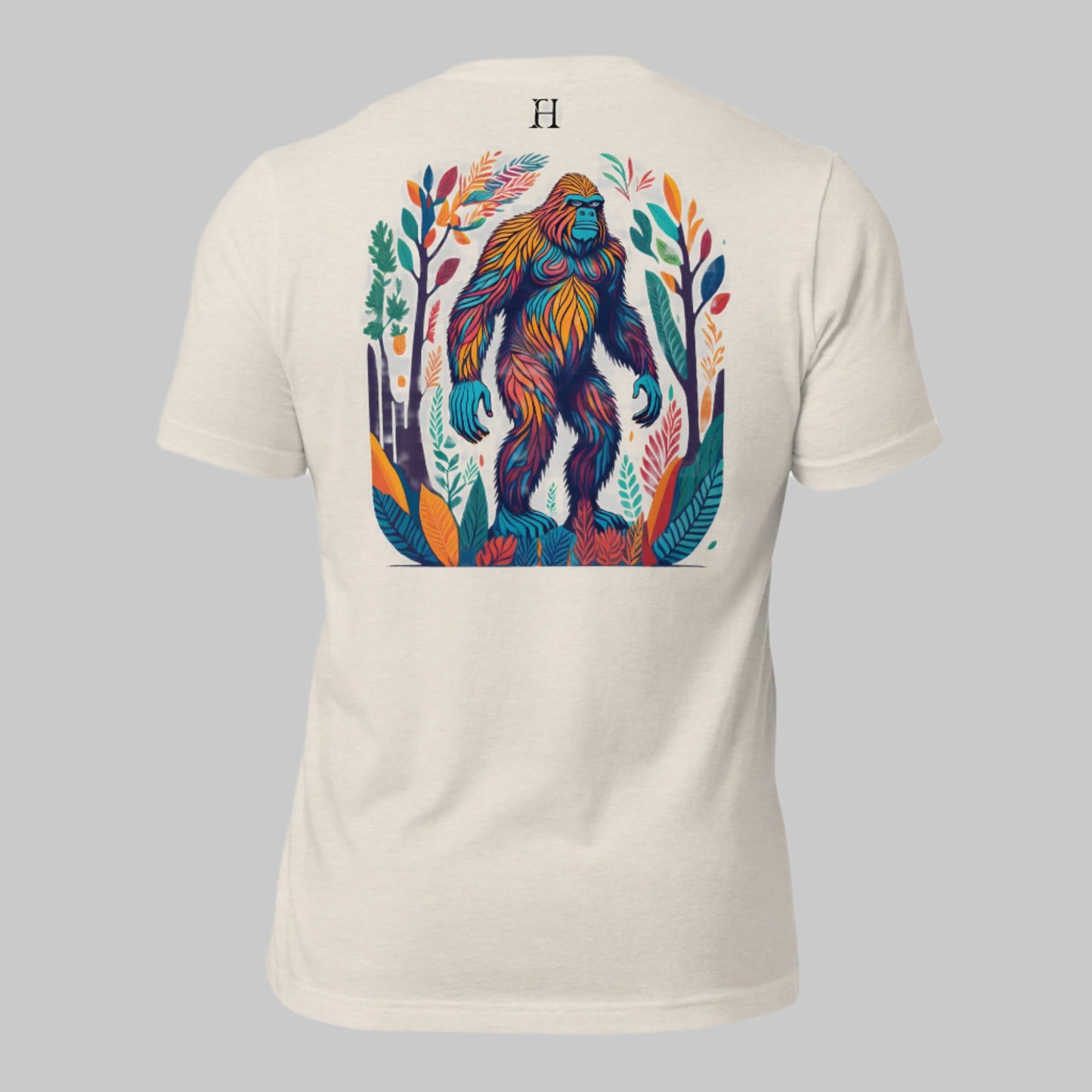 Back of Camo Challenge T-Shirt in Dust, Multicolored Bigfoot design, with FH logo near collar.