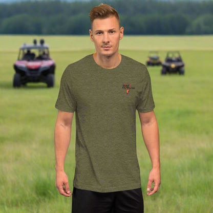 Front of Man wearing Clawed Through Wildlife T-Shirt in Olive with deer logo and the words Hunt Fearless.