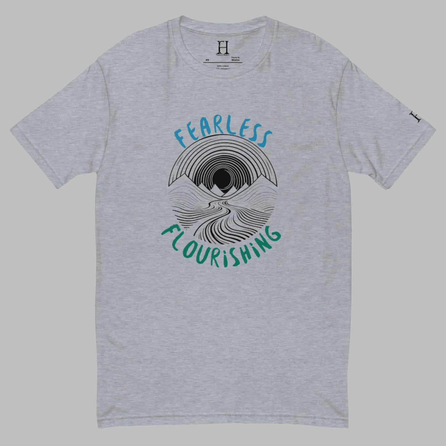 Front of grey T-shirt with black outline of a river flowing through mountains and the words Fearless and Flourishing.