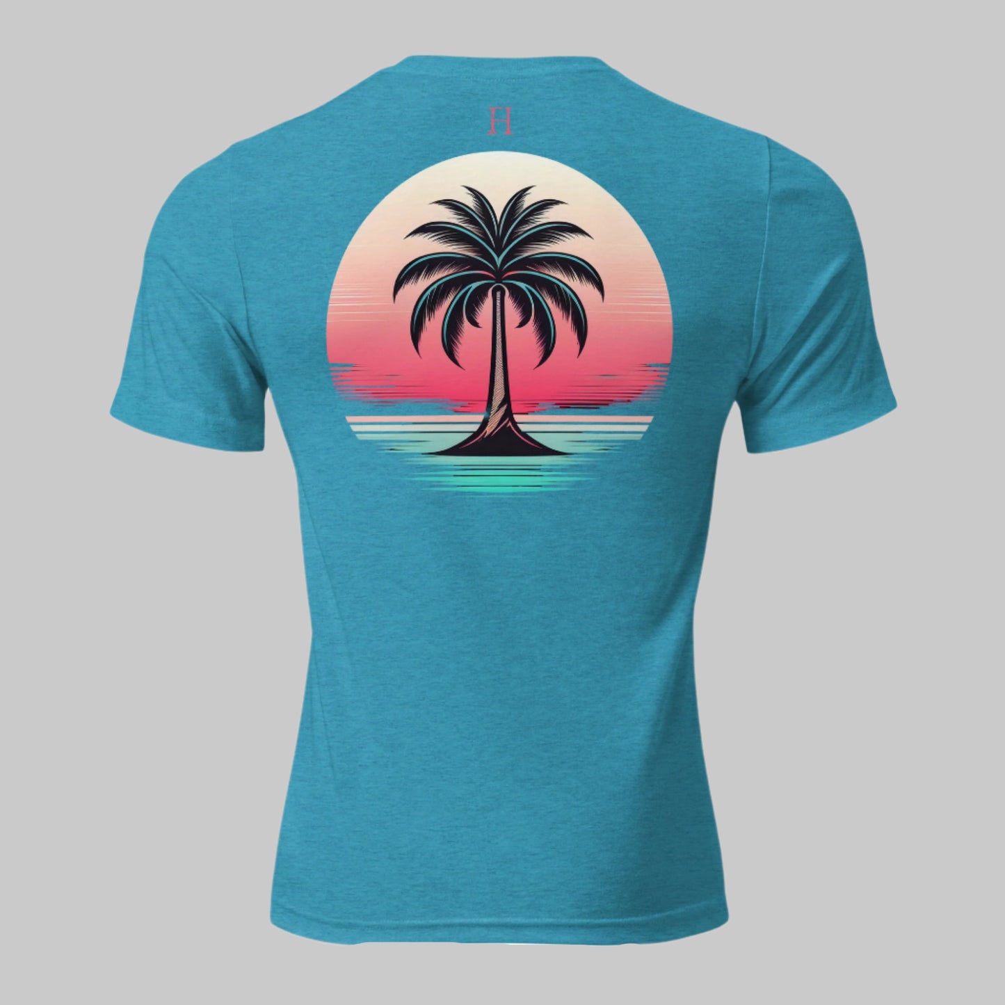 Back of Casual Graphic T-Shirt in Aqua with image of a Palm Tree at the beach during sunset.