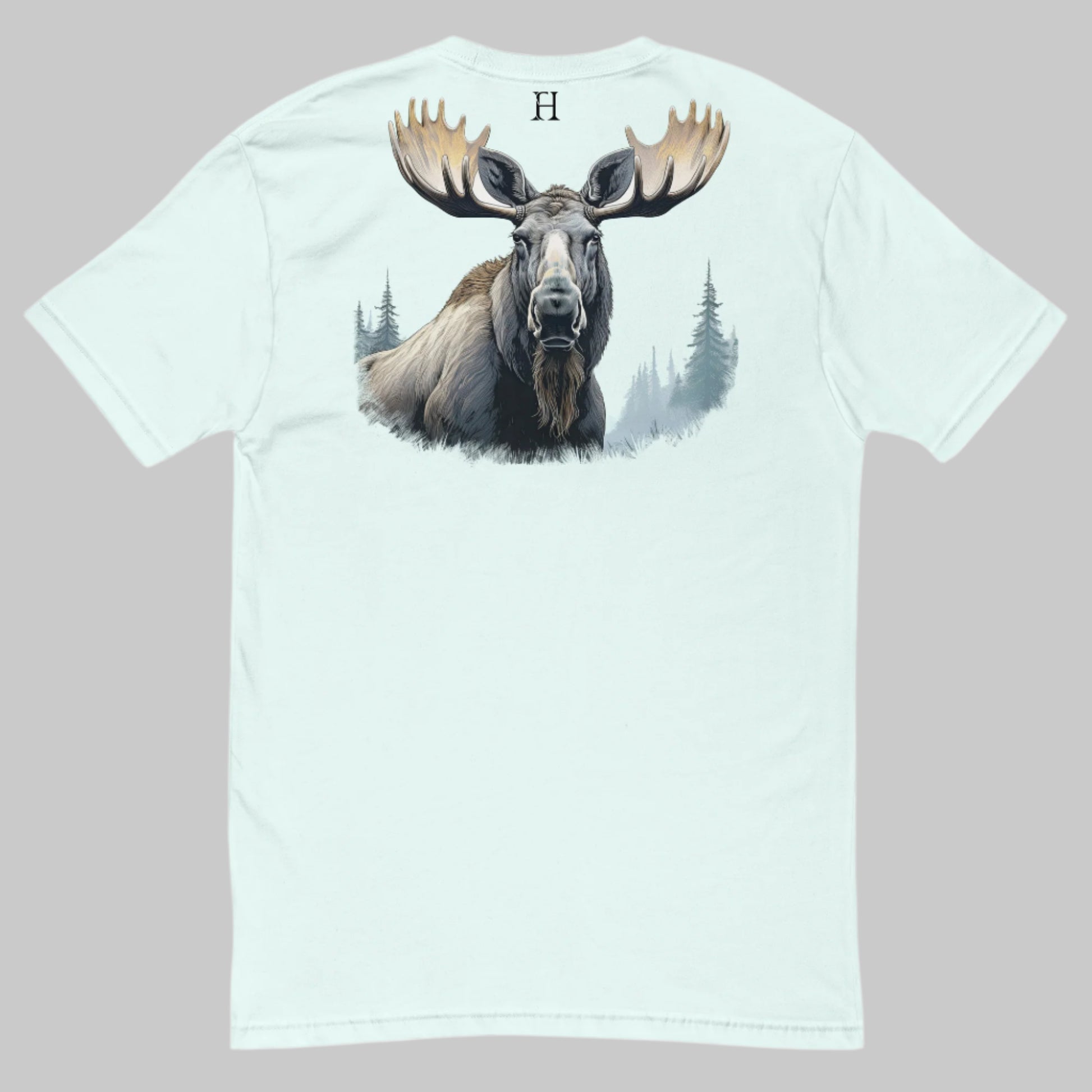 Back of Mighty Moose T-Shirt in Light Blue with a colorful buck deer graphic, and FH logo at top center in black.