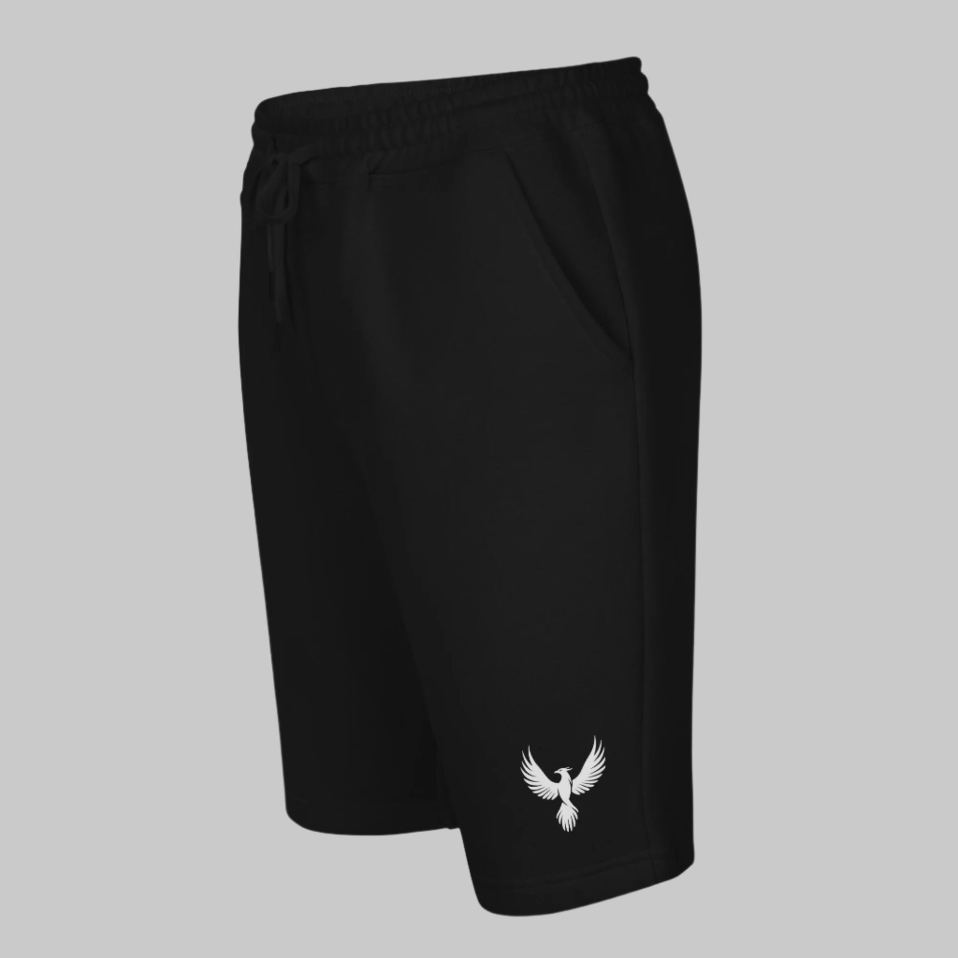 Front Left of Emblem Fleece Shorts in Black, with a phoenix design on lower right pant leg in white.