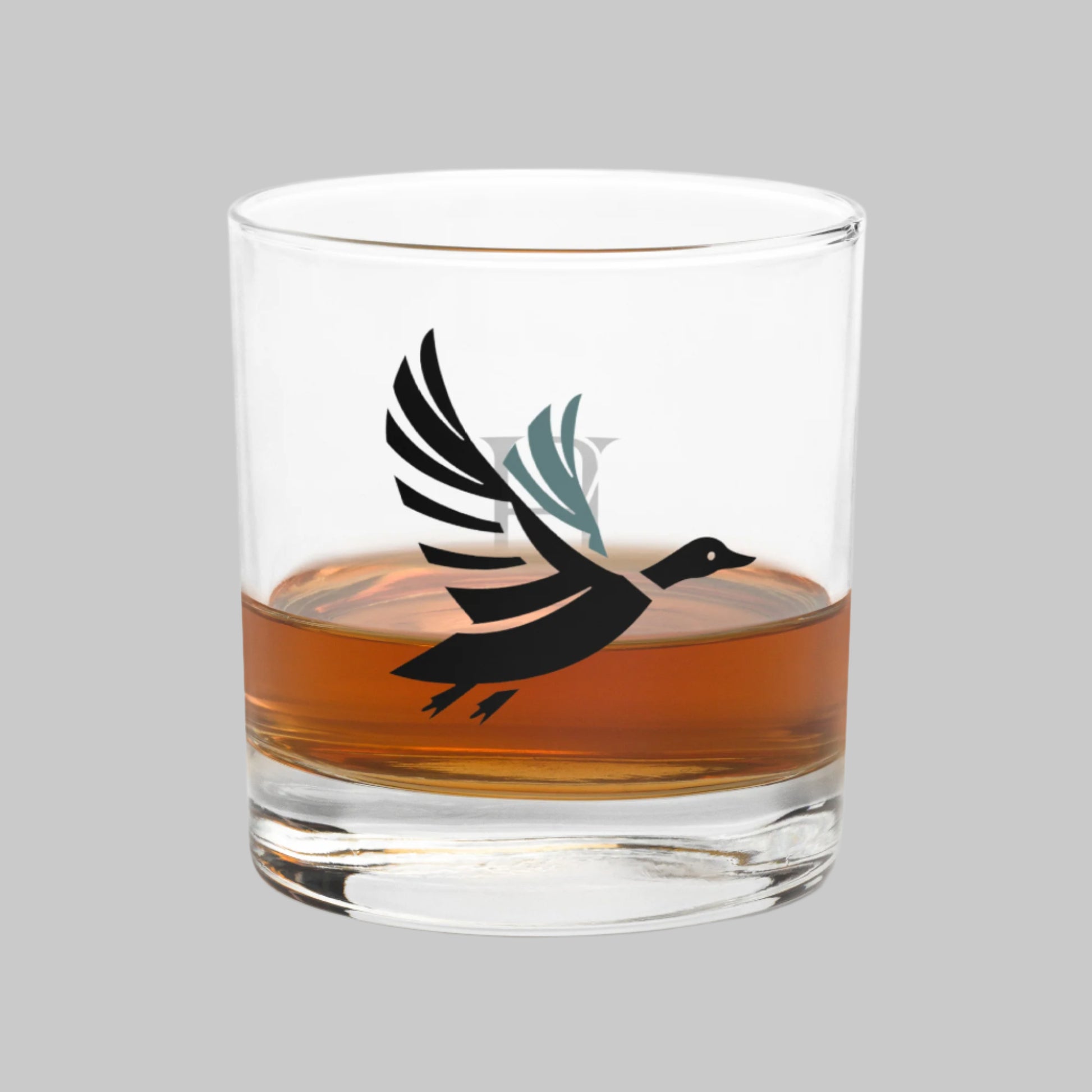 Left side of Drake Flight Rocks Whiskey Glass with Flying Duck Design.