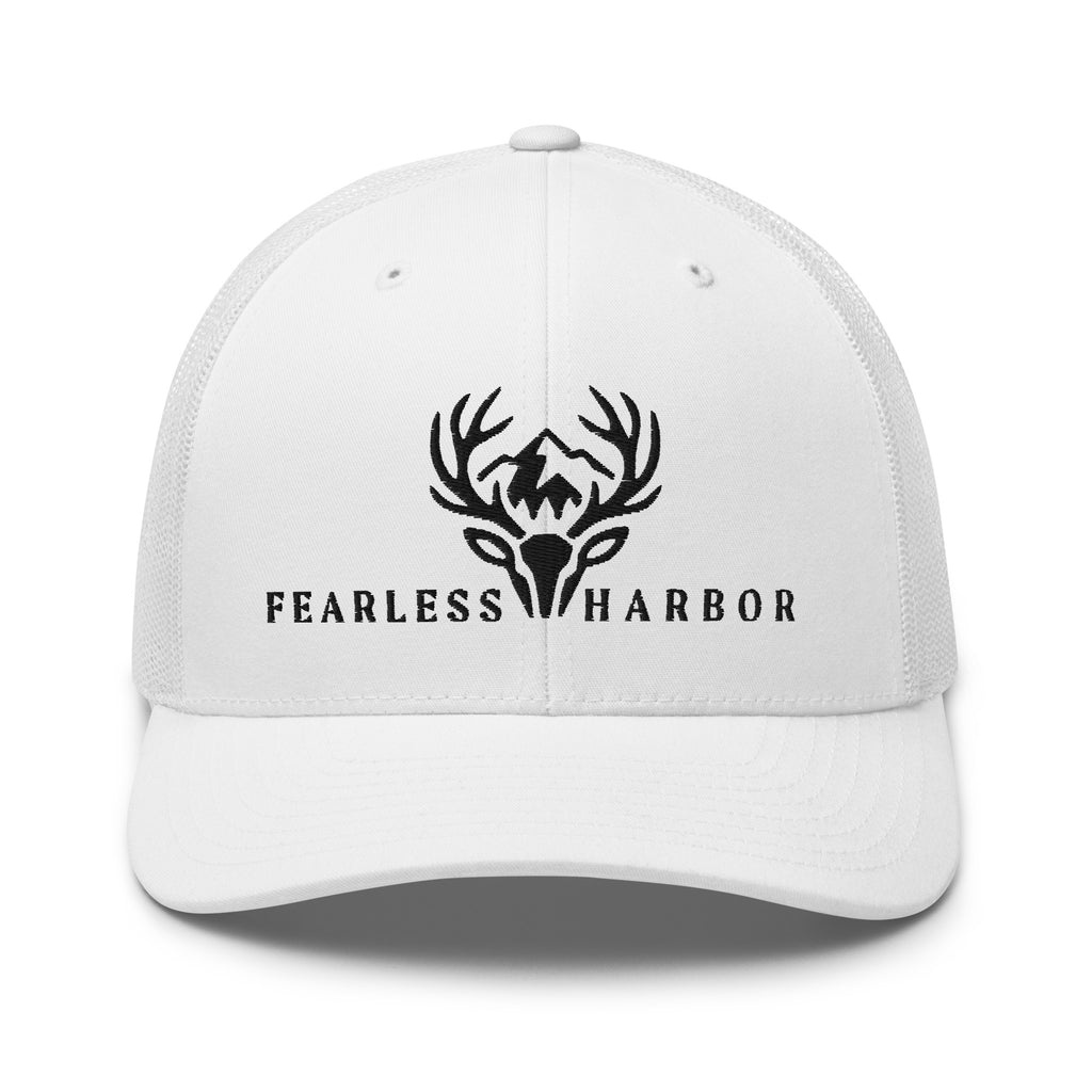 White trucker hat displaying embroidered Fearless Harbor whitetail logo on the front.