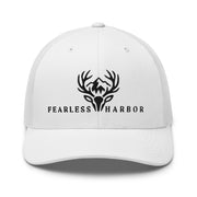 White trucker hat displaying embroidered Fearless Harbor whitetail logo on the front.