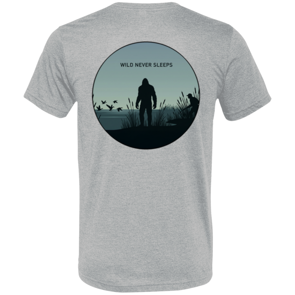 Back view of the Men’s Wild Never Sleeps Bigfoot Duck Hunting Premium Tee in Athletic Grey showing a marsh scene with a standing Bigfoot silhouette, a duck hunter in the reeds, flying waterfowl, and Wild Never Sleeps text.