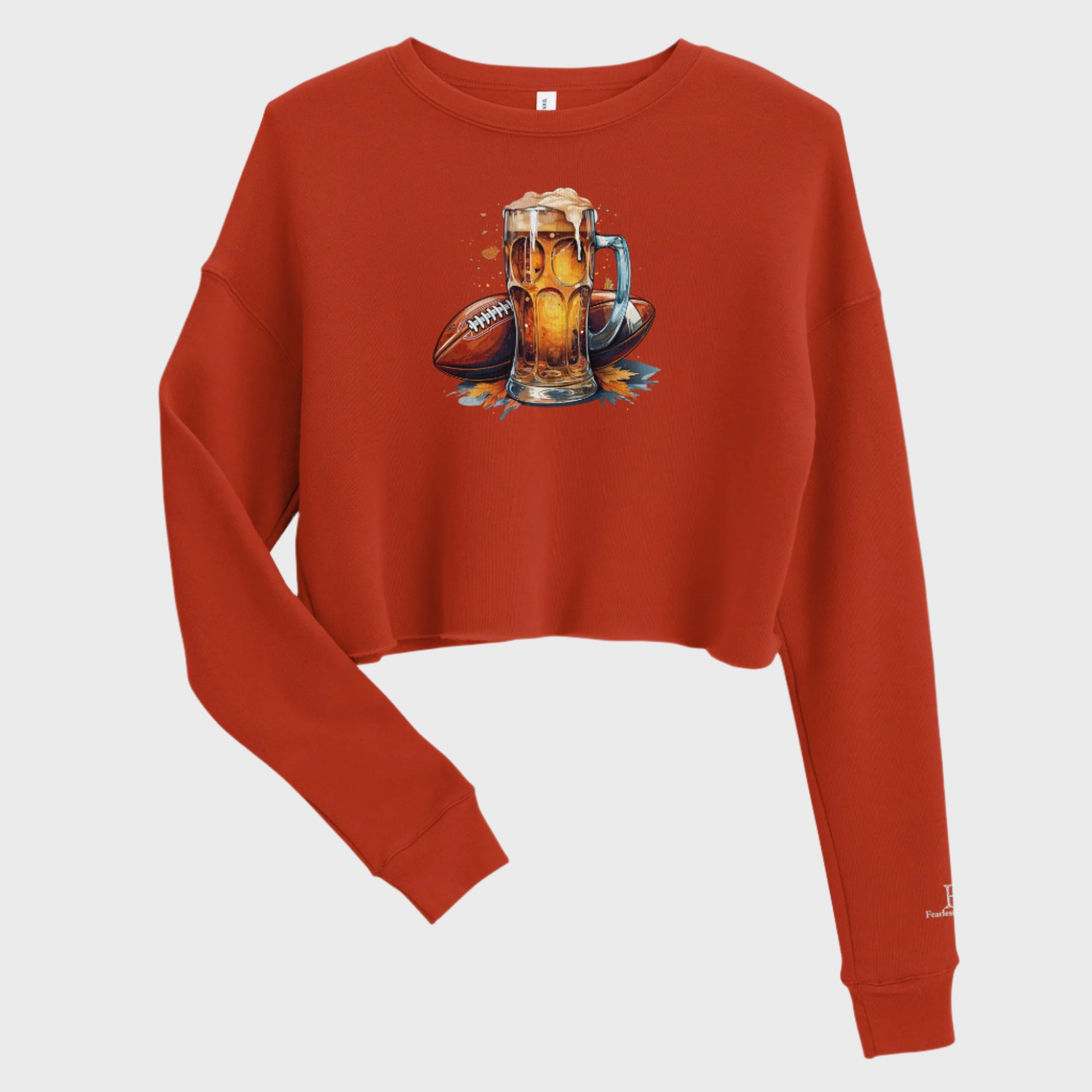 Front of Autumn Tailgate Fleece Crop Sweatshirt in Brick with Fall time football and beer design. 