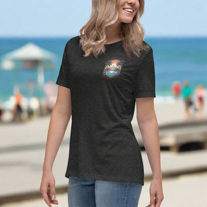 Front of Woman wearing Beach Emblem Relaxed T-Shirt in Dark Grey, with Beach logo on top left and words Fearless Flourishing.