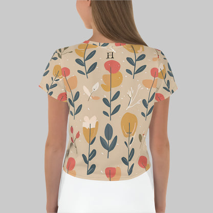 Back of Woman wearing Fearless Crop Top T-Shirt in Light Taupe with a floral flower pattern.