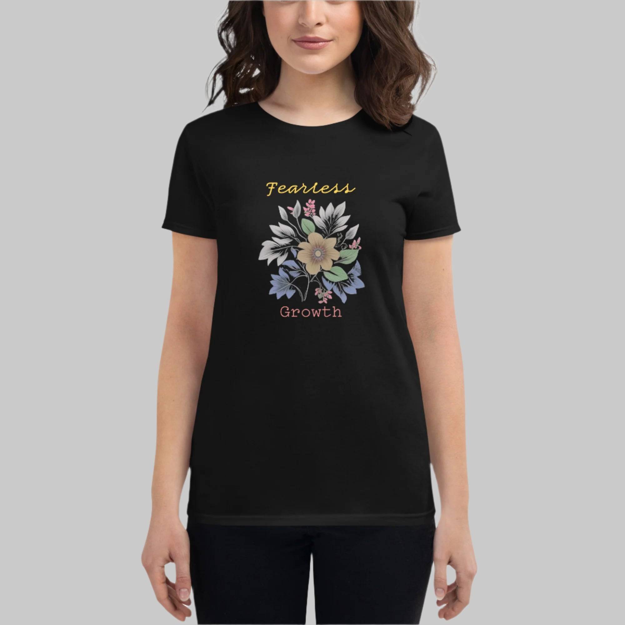 Front of Woman wearing Fearless Growth T-Shirt in Black with a floral flower plant graphic, and the text Fearless Growth. 