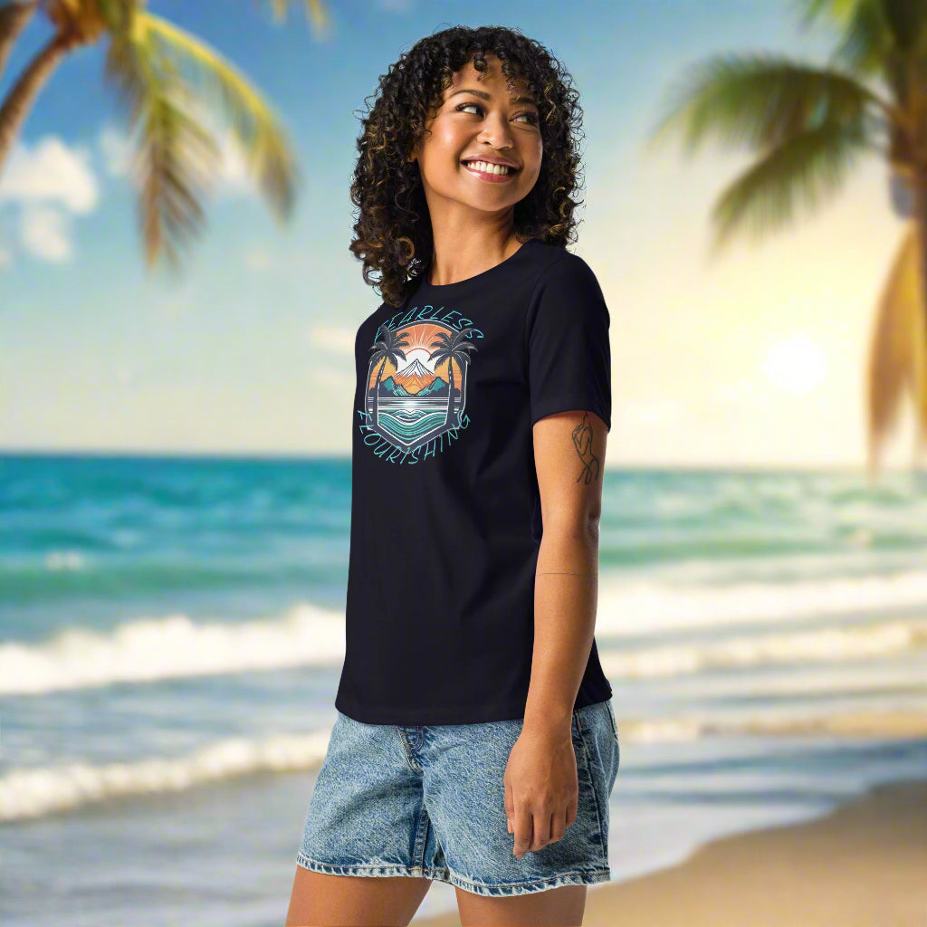 Front of  Women wearing Relaxed Fit Tee – Casual Beach & Island Vibes in Navy with image of Beach Life and the text Fearless Flourishing.