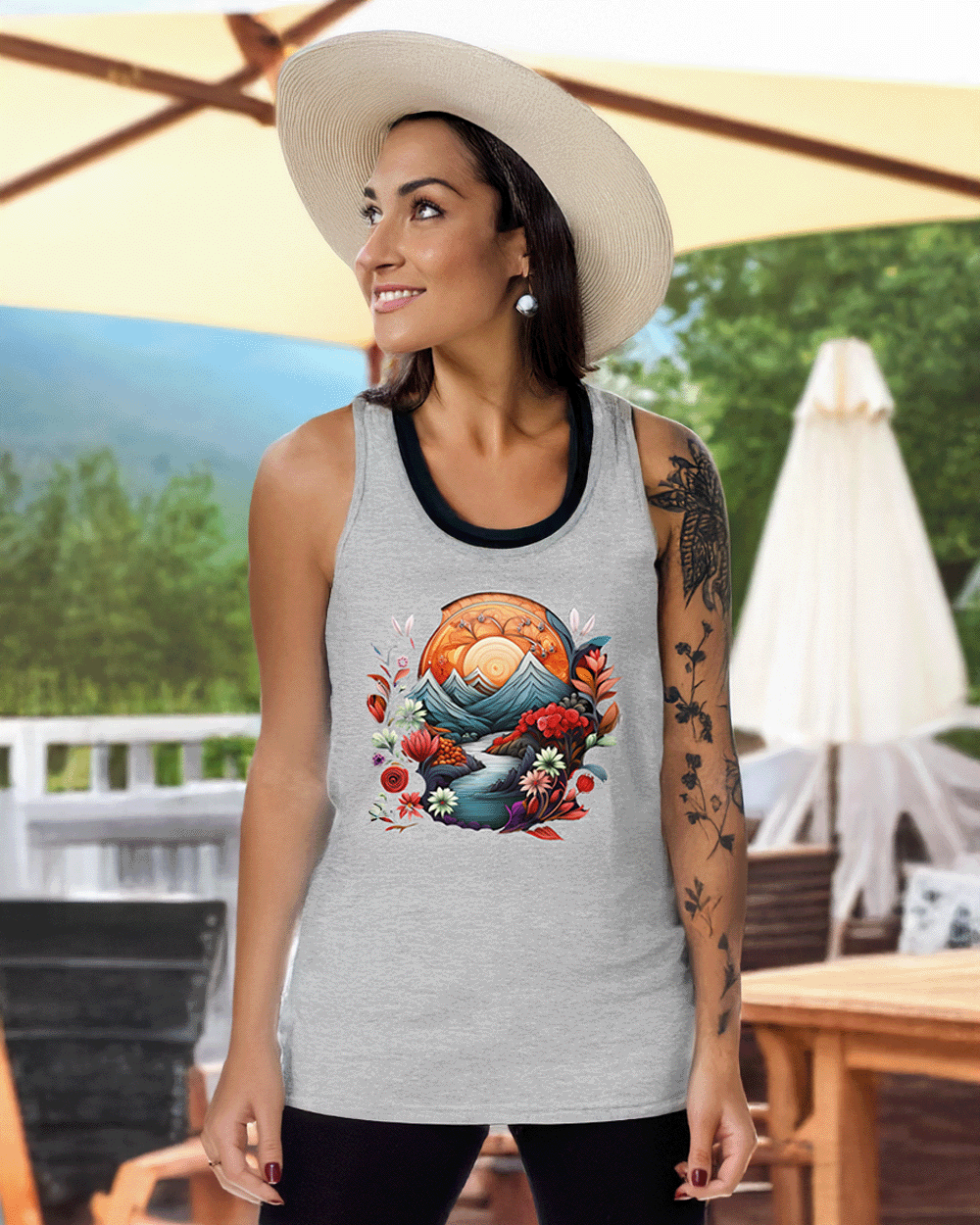A woman in a sun hat wears the athletic heather Plant Mountain tank at a summer BBQ, channeling laid-back outdoor energy.