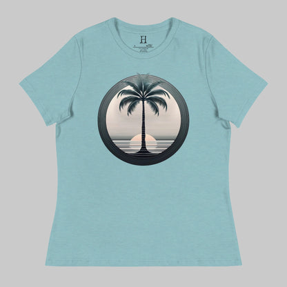 Front of T-Shirt in Blue Lagoon with a Palm Tree and Sunset in background design.