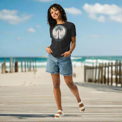 Front of Woman wearing T-shirt in Dark Grey with Palm Tree Design.