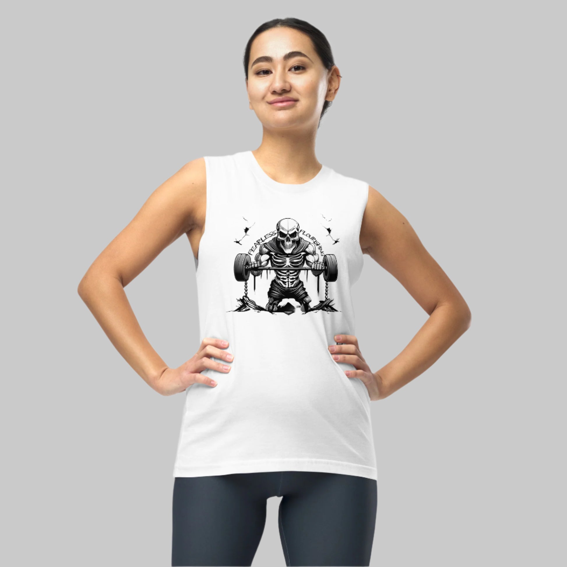 Front of  Woman wearing Undead Gym Tank in White,  Skull Skeleton lifting weights design, text Fearless Flourishing in black.