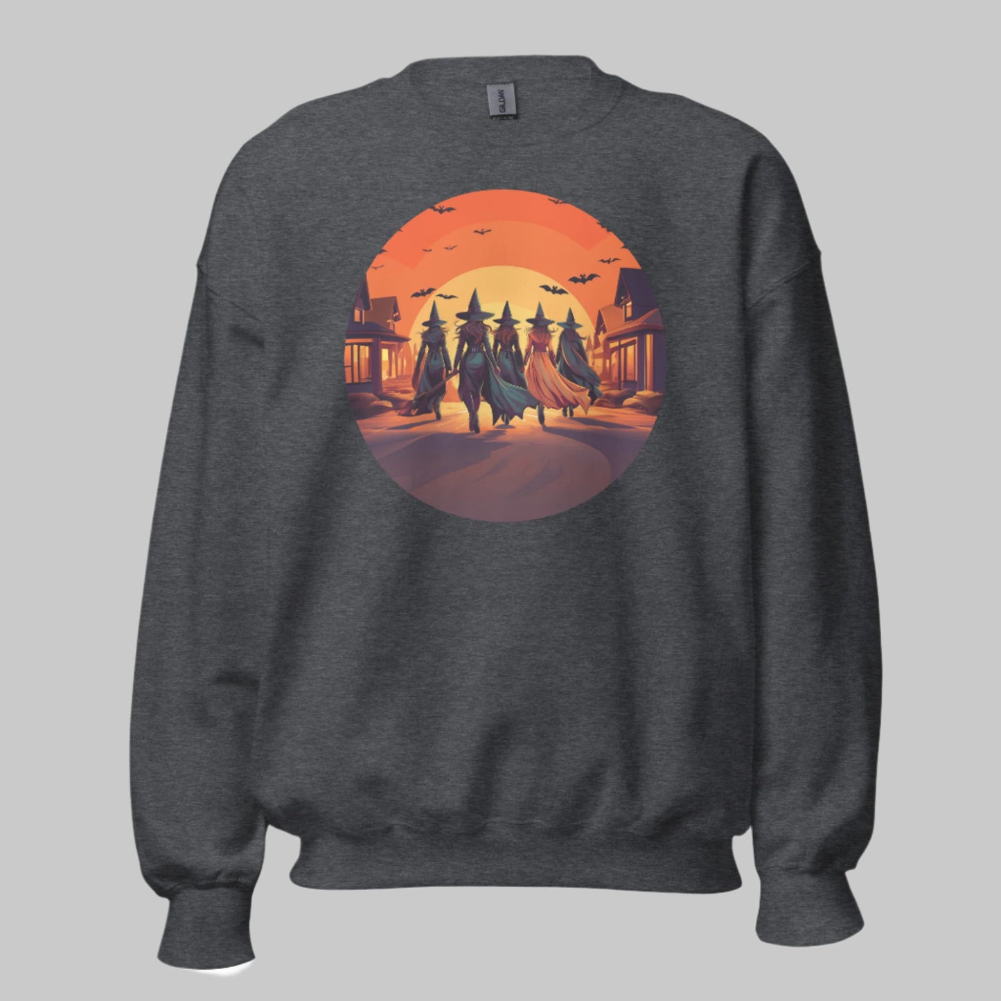 Front of Witches' Crew Trick R Treat Sweatshirt in Charcoal, spooky coven walking down neighborhood street at sunset design.