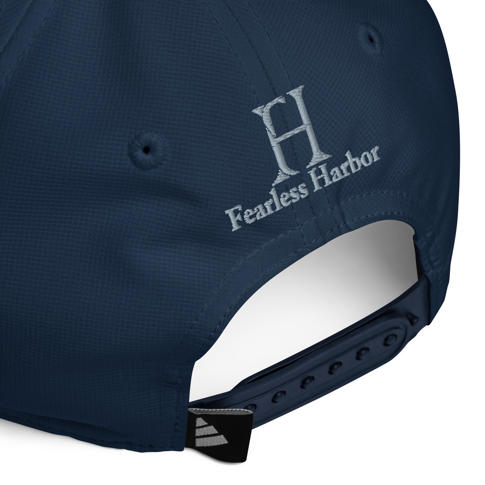 Back of Phoenix Performance Hat in Navy, with navy snap enclosure, and grey embroidered FH logo.