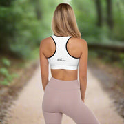 Back view of a woman wearing Fearless Harbor Shadowed Flight Padded Sports Bra in White with black trim, showcasing racerback.