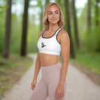 Front left view of a woman wearing Fearless Harbor Shadowed Flight Padded Sports Bra in White with black trim and duck graphic.