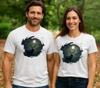 Man and woman wearing white t-shirts with a deer and spooky camo Halloween moon design outdoors.