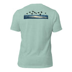 Men's Drift Line Waterfowl Tee in Heather Prism Dusty Blue showing ducks drifting across a marsh horizon scene