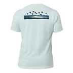 Men's Drift Line Waterfowl Tee in Heather Prism Ice Blue with ducks flying over marsh grass and waterline graphic