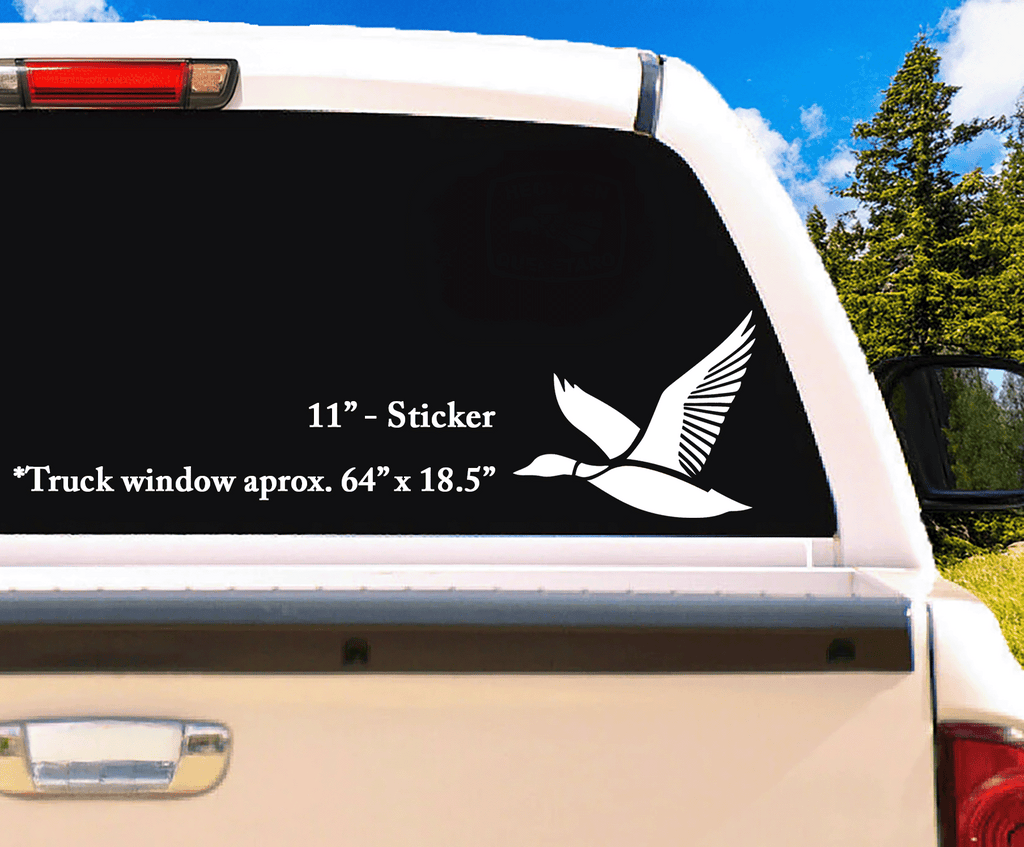 Full-scale 11" white duck decal installed on a rear truck window, standing out with bold lines and all-weather durability.
